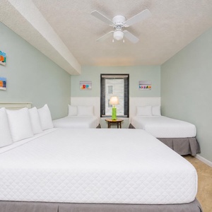 Unwind in this guest suite with a queen and two twins, for restful sleep after beach adventures and playful days
