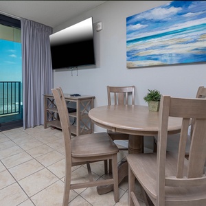 Enjoy meals or games at the round dining table while taking in the beach view from the balcony