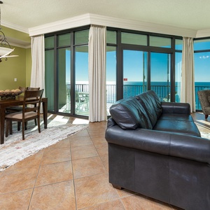 Savor the stunning coastal views from your cozy couch while enjoying quality family time together in this inviting space