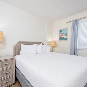 Sink into the plush bedding of the queen guest suite, ready for a night of restful sleep after beach adventures