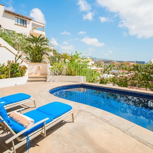 Patio with lounge chairs and pool