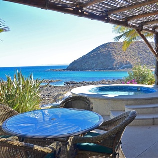 Patio with jacuzzi and ocean view