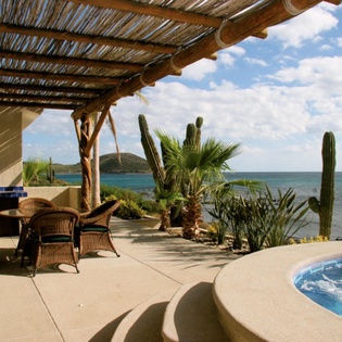 Patio with jacuzzi and ocean view