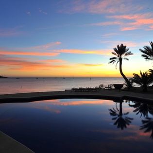 Pool with beautiful ocean view at sunset