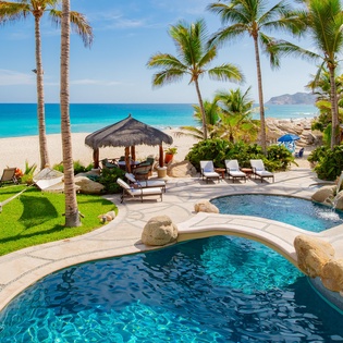 Patio with pool and beach view