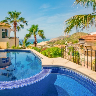Patio with lounge chairs and pool