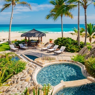 Gorgeous patio with pool and beachfront