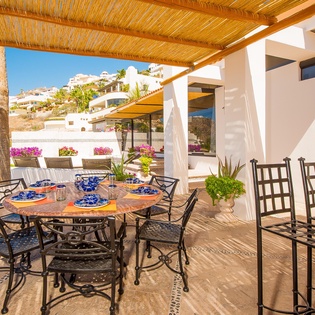 Covered outdoor dining with bar