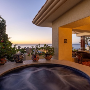 Jacuzzi with ocean views during sunset