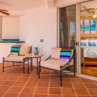 Suite with king bed and door to patio