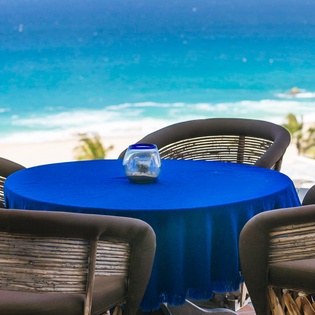 Cozy outdoor dining with ocean view