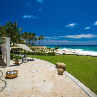 Beachfront patio and lawn