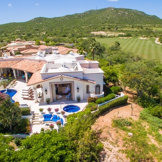 Aerial overview of villa on golf course