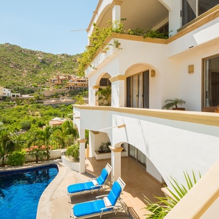 Patio with pool and lounge chairs