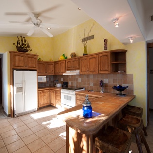 Sunlit kitchen with bar stools