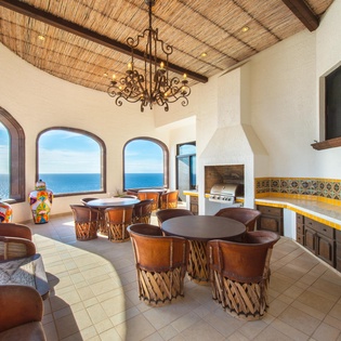 Covered patio with dining for 12 with bar and grill
