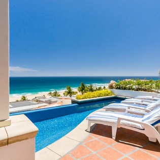 Ocean view patio with lounge and pool