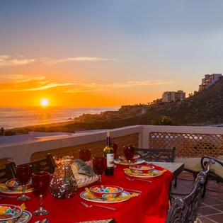 Upper terrace dining with sunset view