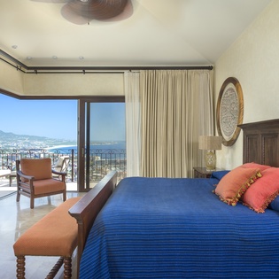 Bedroom suite with pocket door and ocean view