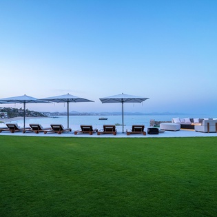 Infinity pool with beachfront views