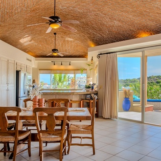 Dining area and ocean views with patio access