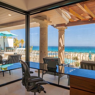 Work with stunning ocean views from your private business workspace, where elegant architecture frames endless blue horizons and swaying palms.