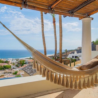 Swing gently in your private hammock while soaking in sweeping ocean and coastal views—this breezy terrace is your perfect escape for lazy afternoons.