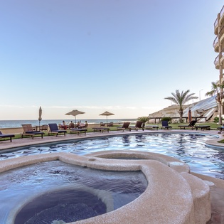 Multiple jacuzzies and pool with ocean views