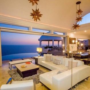 Living  room with access to outdoor patio and ocean view