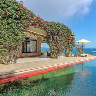 Patio with pool and beach view