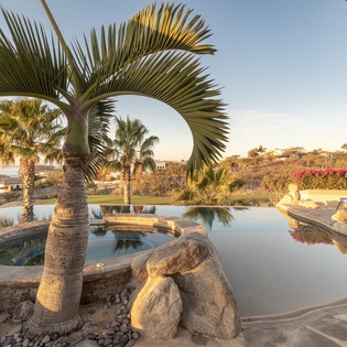 Jacuzzi and infinity pool during sunset