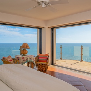 Bedroom suite with private terrace and ocean views