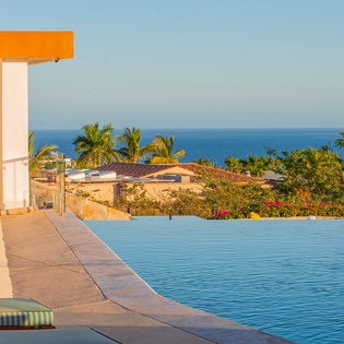 Poolside patio with ocean view