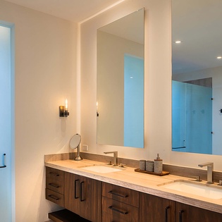Prepare for your day in this elegant bathroom featuring a spacious double vanity and modern finishes that make your morning routine feel effortless.