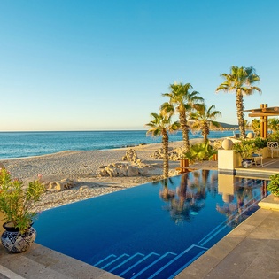 Patio with infinity pool and amazing beachfront views