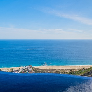 Infinity pool overlooking gorgeous ocean beachfront views