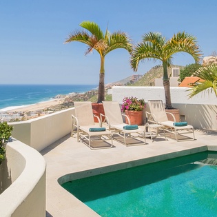 Sunny pool side with ocean view