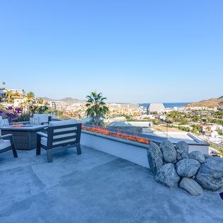 Patio with fire pit and ocean views