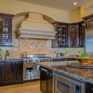 Your gourmet kitchen awaits with granite counters, custom cabinetry, and premium appliances for memorable meal preparation.