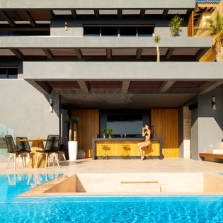 Sunny patio with infinity pool