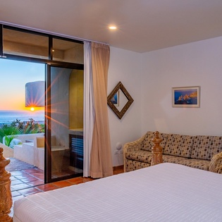 Bedroom suite with terrace access and ocean views