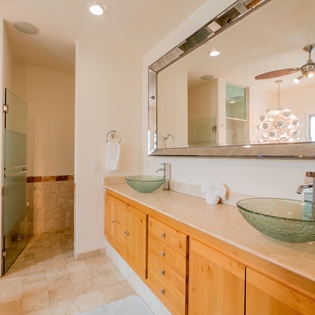 En suite bathroom with walk in shower and double sink