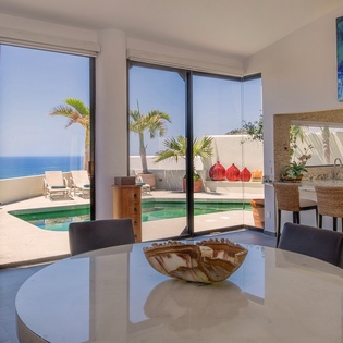 Dining and bar area with ocean view