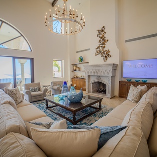 Sink into plush seating by your elegant fireplace while ocean views frame perfect moments of relaxation and luxury.