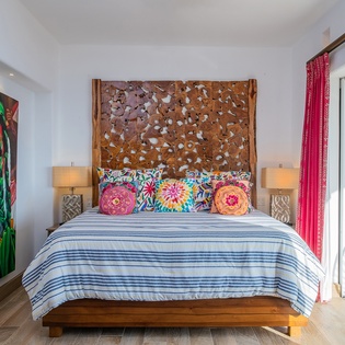 Bedroom suite with terrace access and ocean views