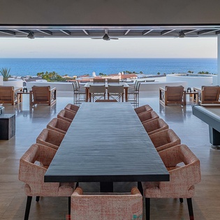 Gather around this grand dining table or lounge on the terrace, where ocean views stretch endlessly across the horizon and every moment feels effortlessly luxurious.