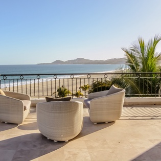 Patio with beachfront and ocean views