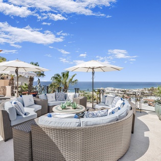 Patio with outside seating and ocean views