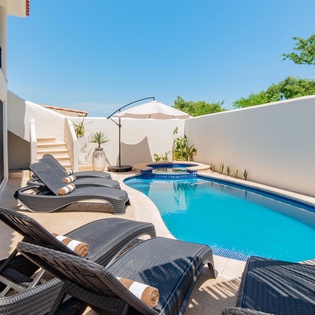 Inviting outdoor terrace with swimming pool, jacuzzi and patio furniture
