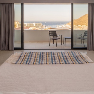 Bedroom suite with terrace access and views